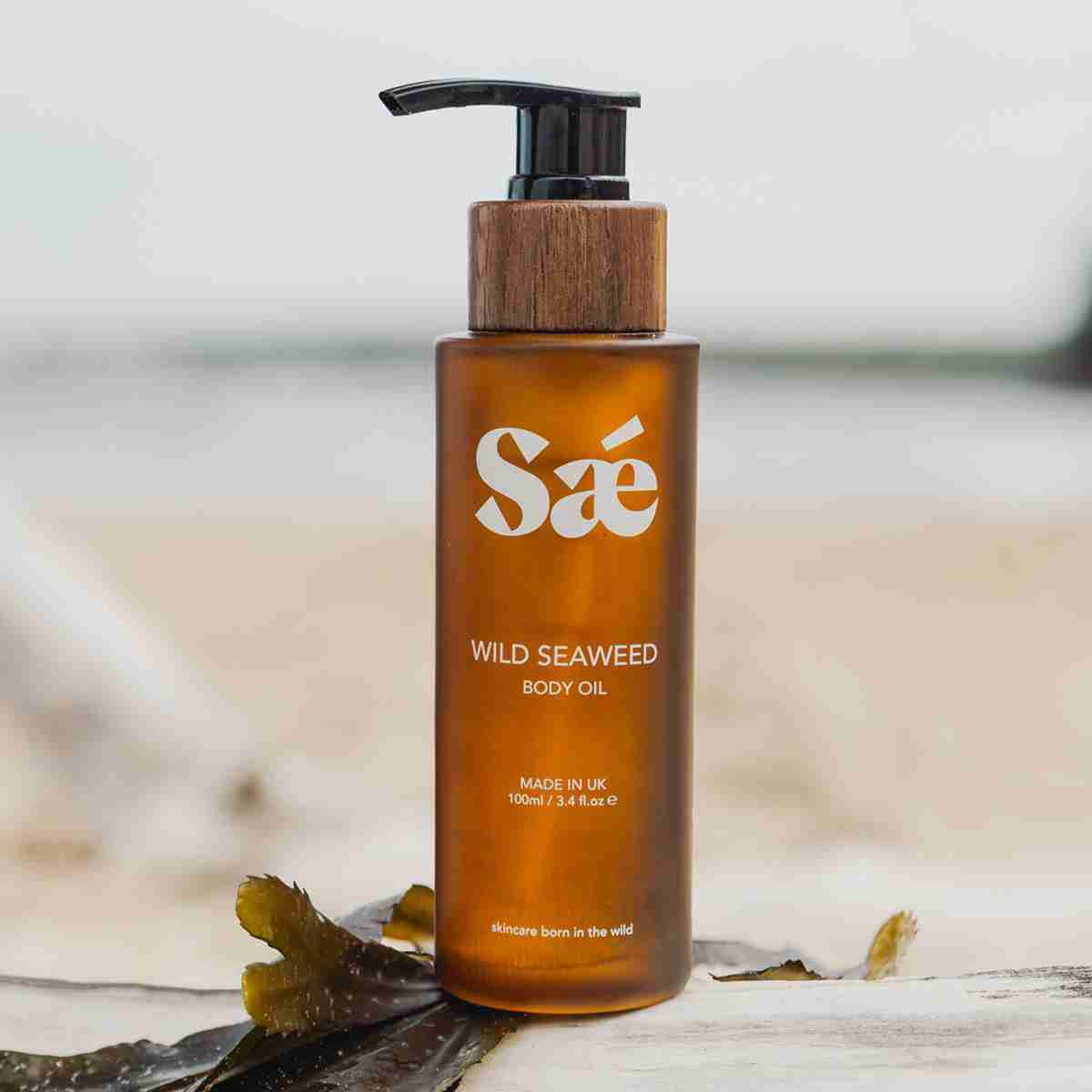 sae seaweed replenishing body oil in glass bottle